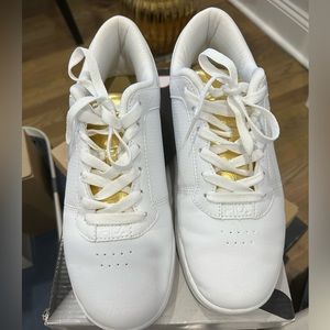 White and gold Fila sneakers